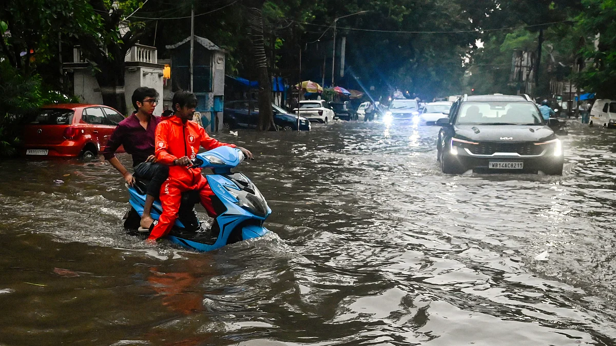 Kolkata: Vehicles wade through a waterlogged road in Kolkata, 25 June 25