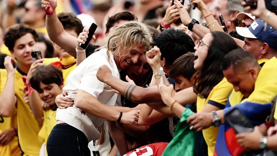 Sebastian Beccacece celebrates with his family after Ecuador's shock win against Germany