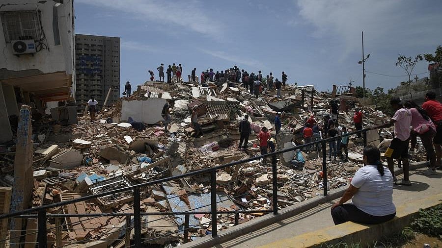 People search for survivors amid quake rubble in Venezuela.