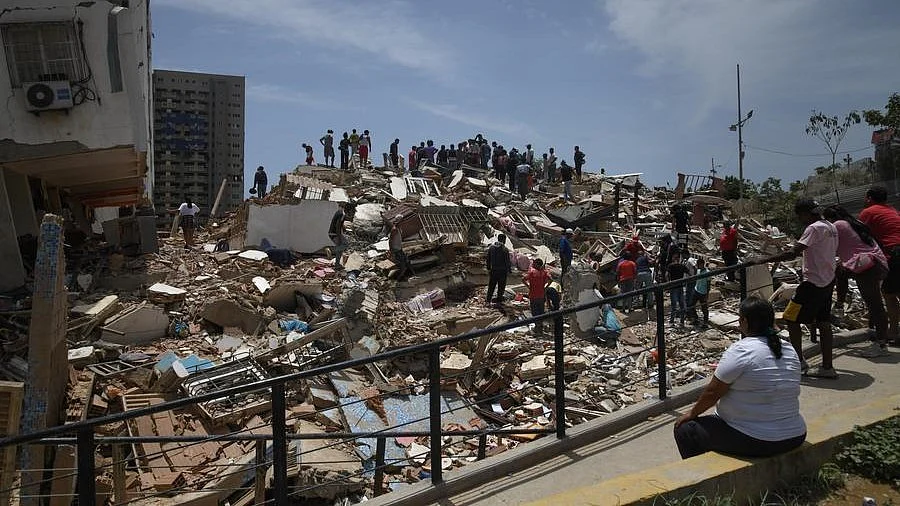 People search for survivors amid quake rubble in Venezuela.