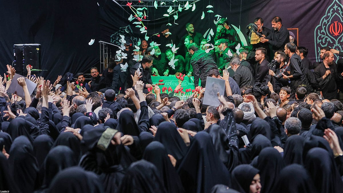 Mourners pay their respects beside Ayatollah Ali Khamenei's coffin in Tehran.