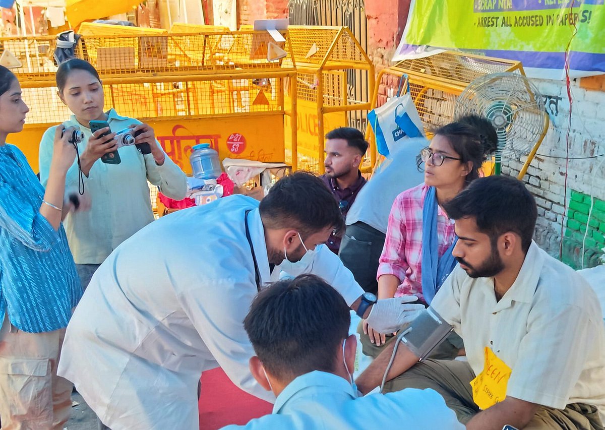 A medical official checks an AISA member on an indefinite hunger strike at Jantar Mantar (Photo: PTI)