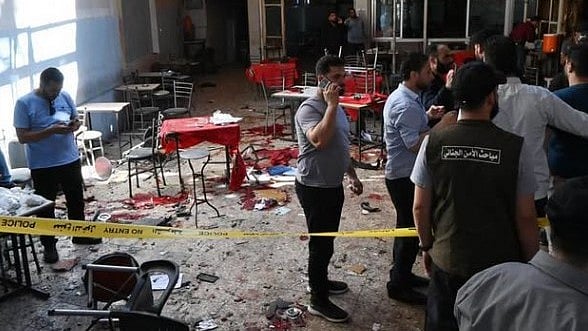 Investigators examine the blast site in Damascus.