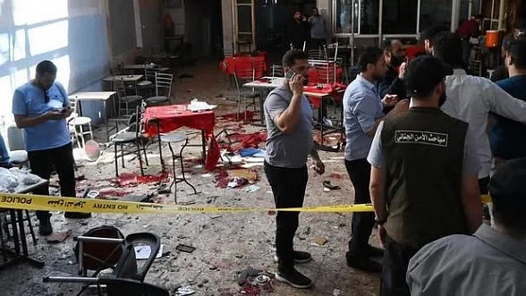 Investigators examine the blast site in Damascus.