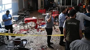 Investigators examine the blast site in Damascus.