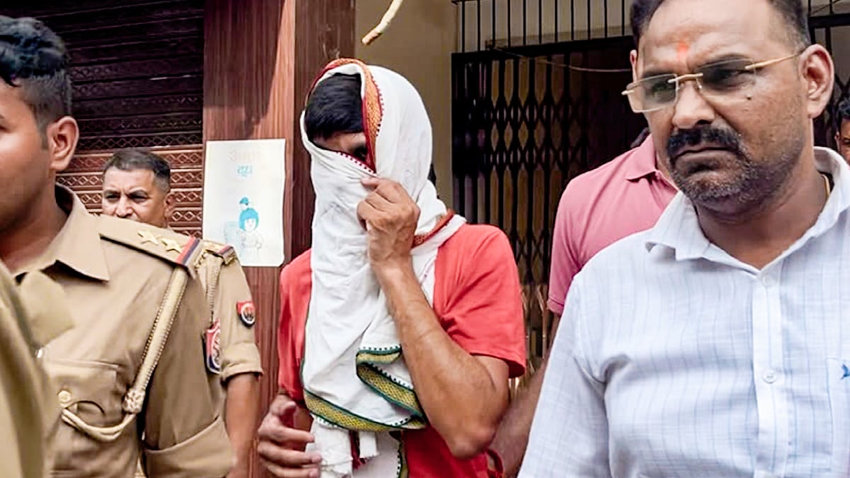 Donation theft case accused Avinash Shukla (face covered) in Ayodhya, 3 July