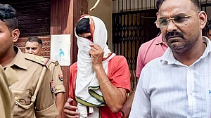 Donation theft case accused Avinash Shukla (face covered) in Ayodhya, 3 July