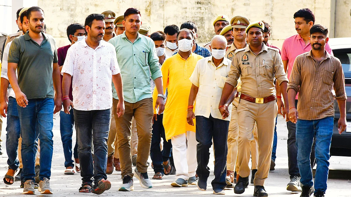 Police escort some of the accused in the Ram Mandir donation embezzlement case