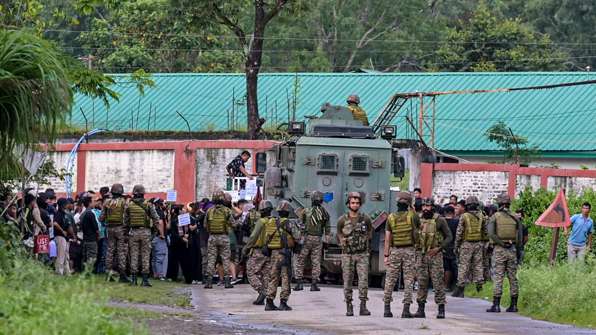 Army personnel stop Kuki protesters marching to a checkpoint set up by Naga blockade enforcers