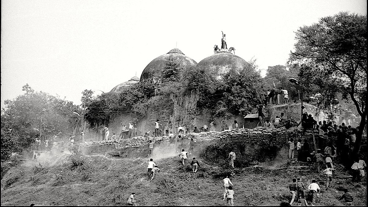 Karsevaks atop the Babri Masjid shortly before it was demolished on 6 December 1992
