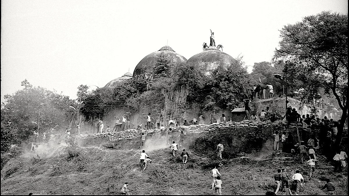 Karsevaks atop the Babri Masjid shortly before it was demolished on 6 December 1992