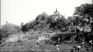 Karsevaks atop the Babri Masjid shortly before it was demolished on 6 December 1992