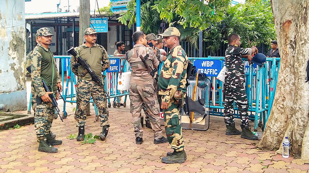 Security personnel outside Baruipur Sub-Divisional Hospital, where the body of the accused has been kept