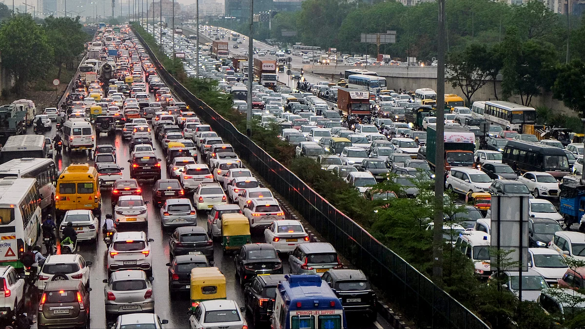 Vehicles crawl through waterlogged roads as heavy rain triggers massive traffic jams across Gurugram.