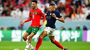 Flashback to Qatar 2022: Aboukhlal (L) is challenged by Mbappe in the semi-final