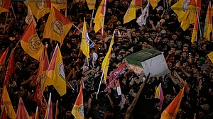 Mourners jostle to touch Ali Khamenei's coffin in Karbala.