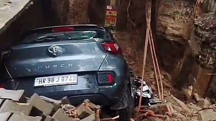 A road caved in Ghaziabad following heavy rains