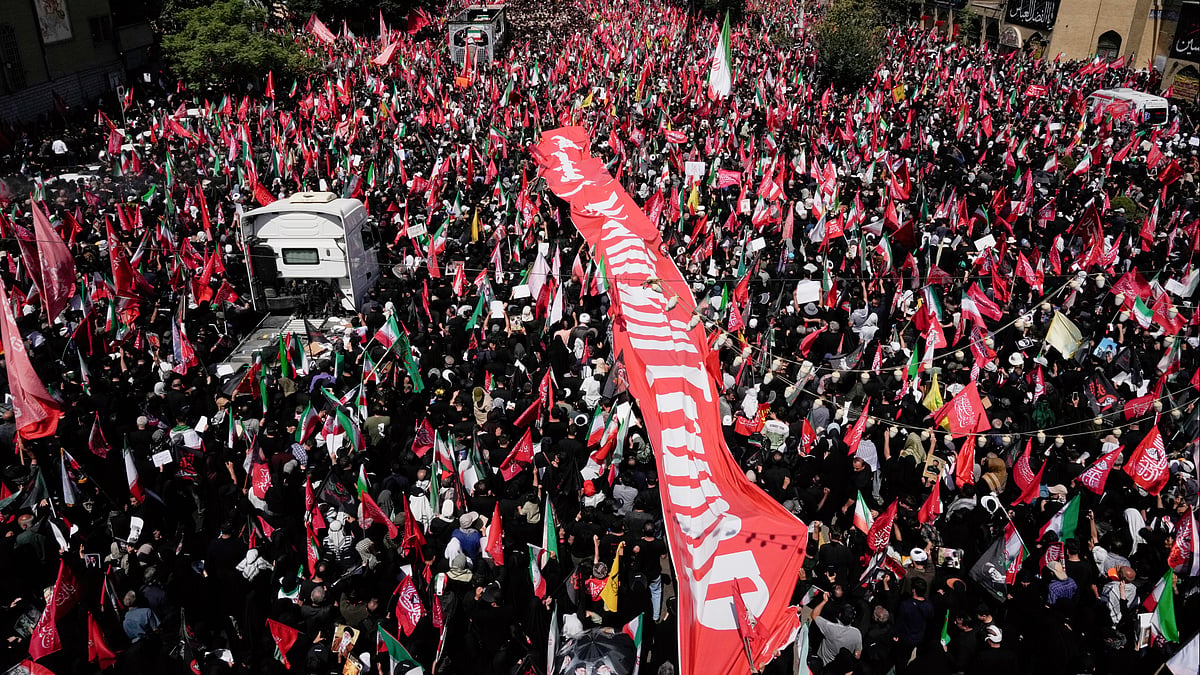Mourners follow the coffins of late Ayatollah Ali Khamenei and members of his family in Tehran