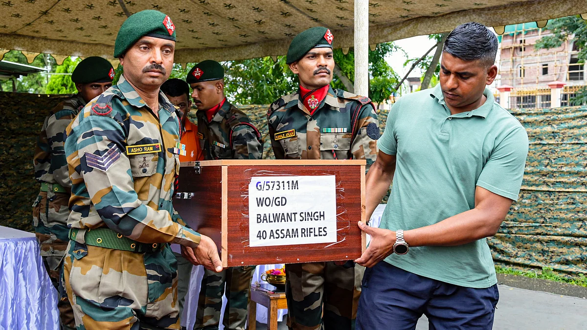 Army personnel carry the coffins of the two slain Assam Rifles personnel in Imphal, 8 July