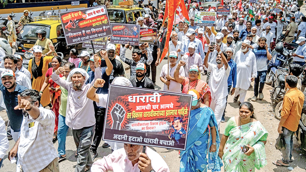 Residents protest the handing over of Dharavi’s redevelopment project to the Adani Group