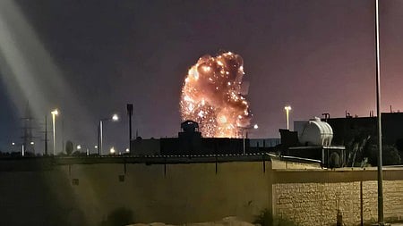 Smoke billows following a US airstrike on an Iranian target.