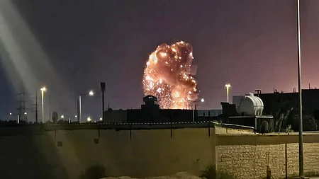 Smoke billows following a US airstrike on an Iranian target.