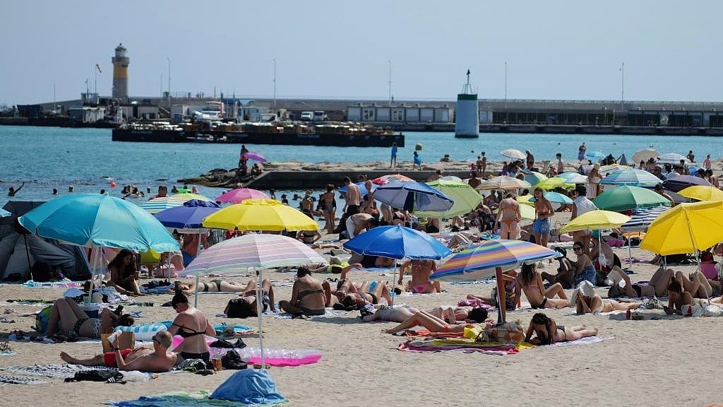People cool off at the seaside amid a heatwave in Cannes.