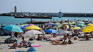 People cool off at the seaside amid a heatwave in Cannes.