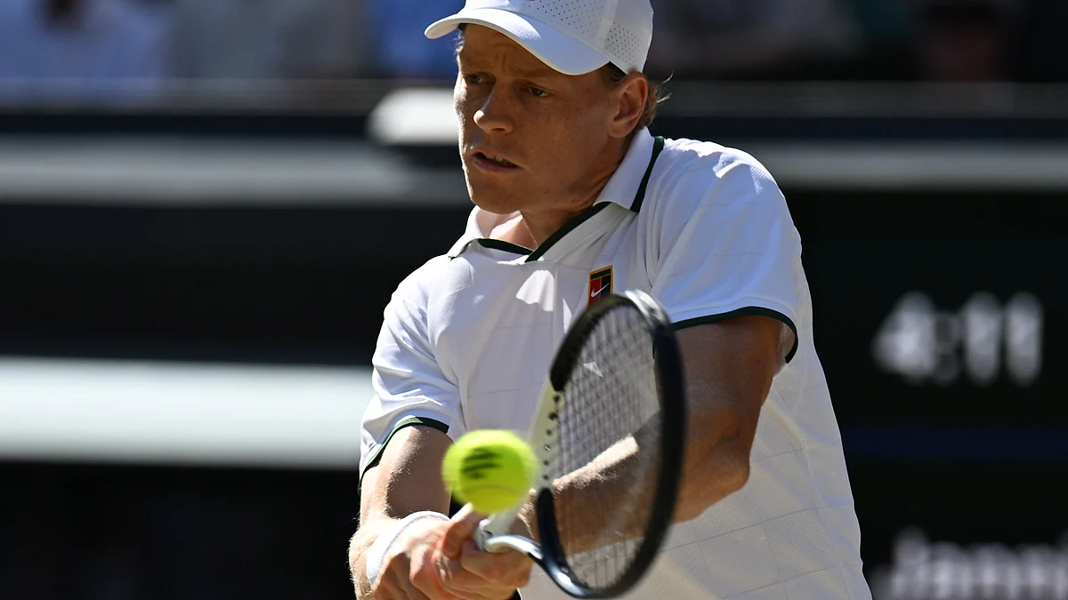 Jannik Sinner returns a shot against Alexander Zverev in the Wimbledon men's singles final.
