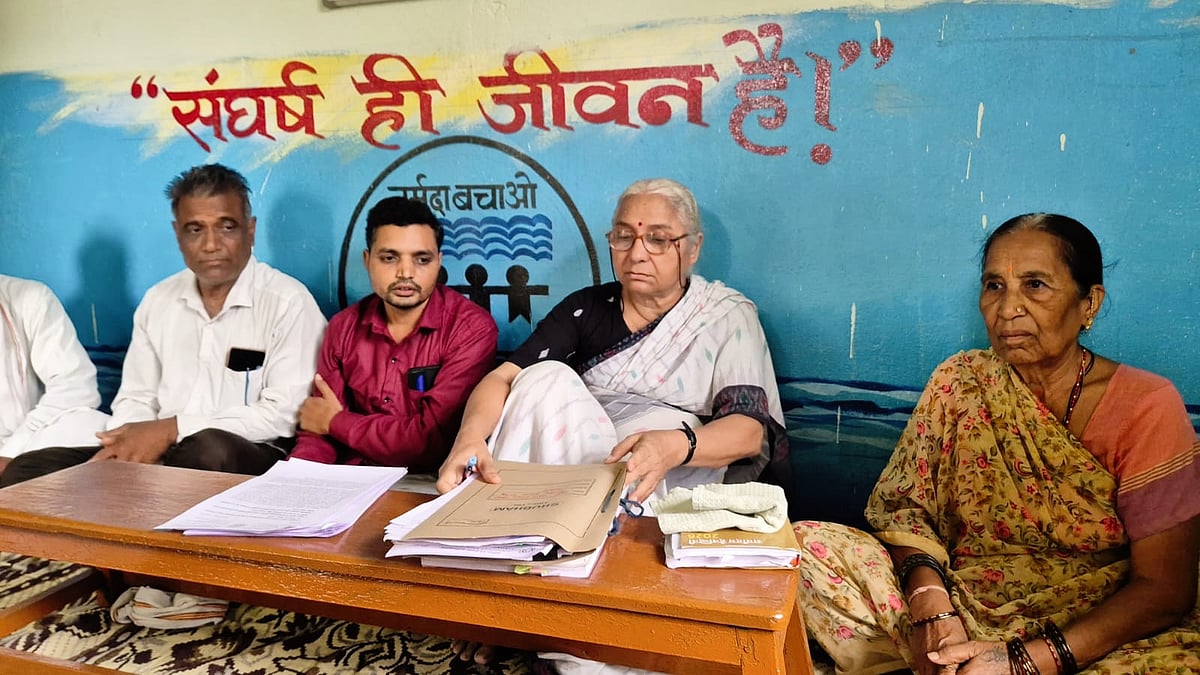 Medha Patkar (C) of the Narmada Bachao Andolan with her team at a press briefing