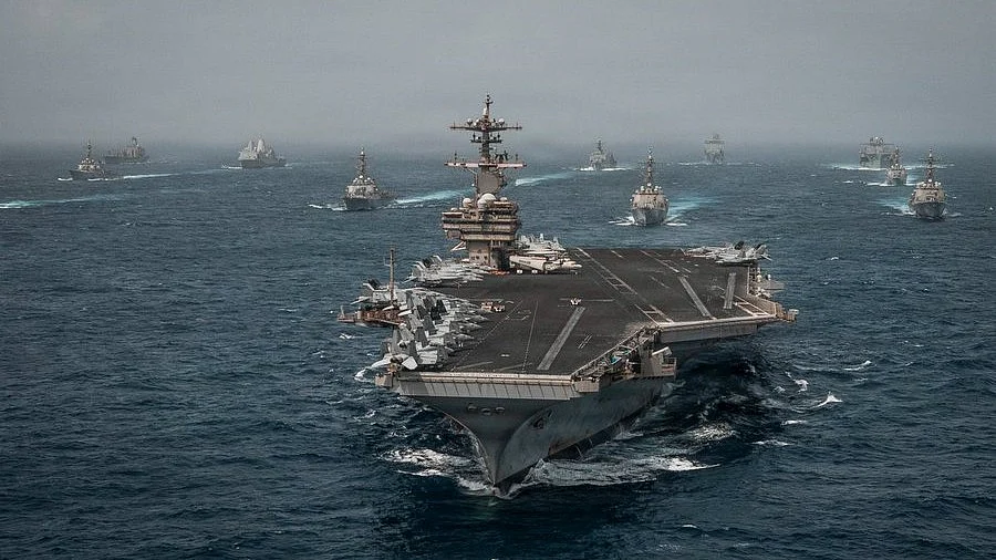 Warships patrol Strait of Hormuz amid rising tensions between United States and Iran.