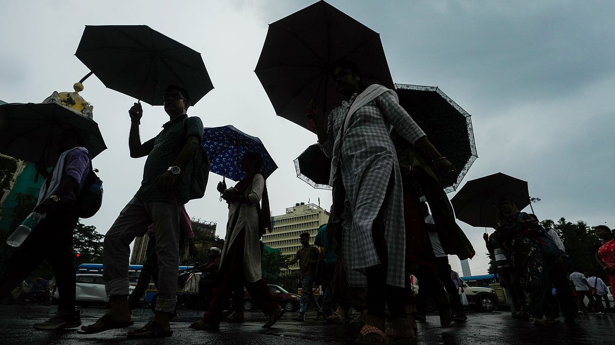 Commuters in the rain, in Kolkata, 13 July
