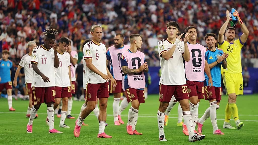 Marching on: Spain in a victory lap after taming France in the semis