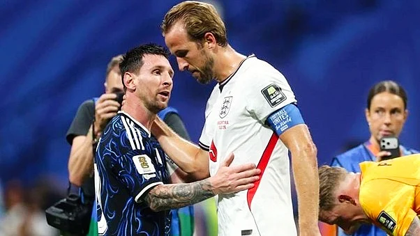 A crestfallen Harry Kane being consoled by Messi after the semi-final