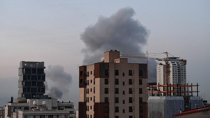 Representational image of smoke billowing as the US and Iran exchange strikes.