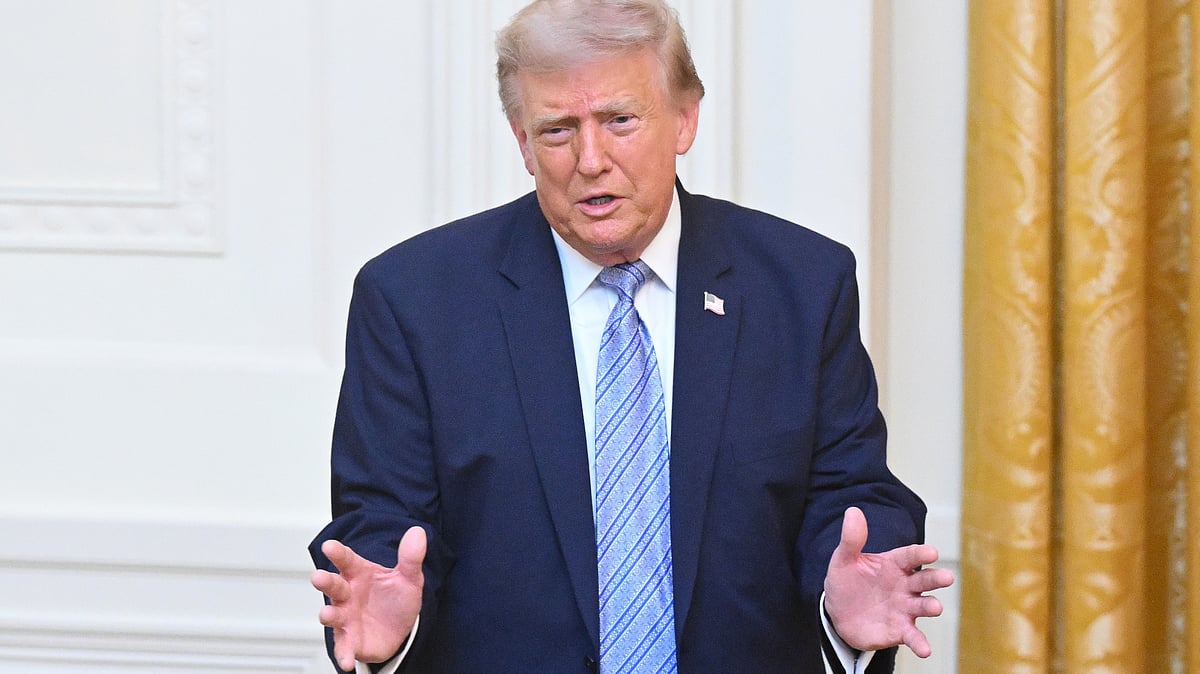 Donald Trump gestures after speaking at White House in Washington.