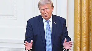 Donald Trump gestures after speaking at White House in Washington.
