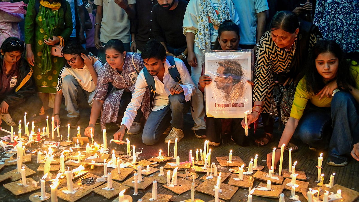 Activists and students light candles during a vigil in solidarity with Sonam Wangchuk in Nagpur, 18 July