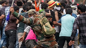 A policeman on a lathi charge