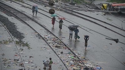 Flood fury grips Assam as rising waters submerge railway tracks in Sivasagar.