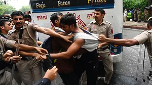 A protestor clashes with police