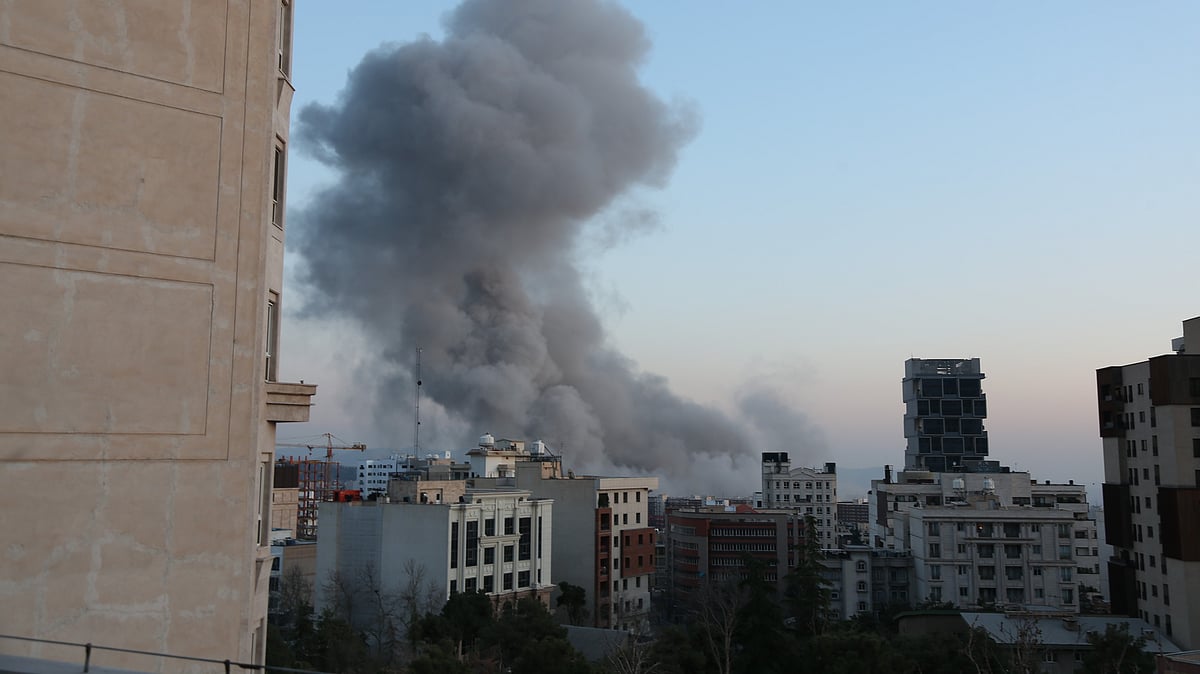 Smoke billows over Tehran following an explosion amid ongoing US strikes.