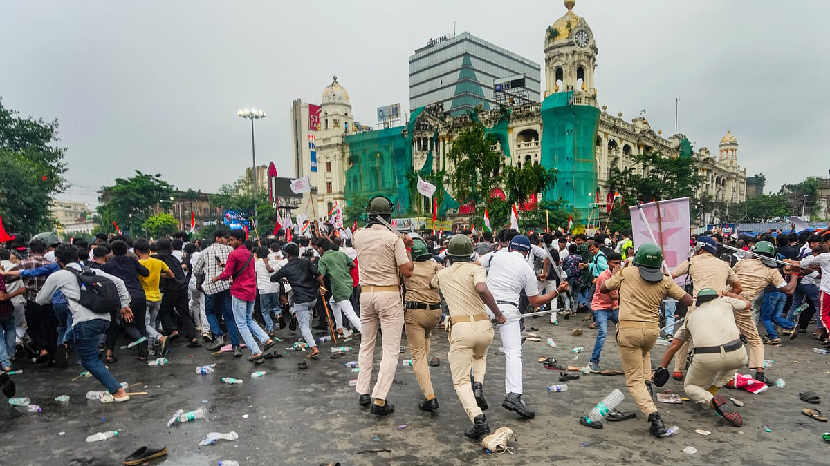 A police lathi charge during the joint protest rally by Left students' bodies and CJP in Kolkata, 24 July