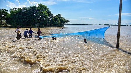 Fishermen on the Dikhow river in Assam.