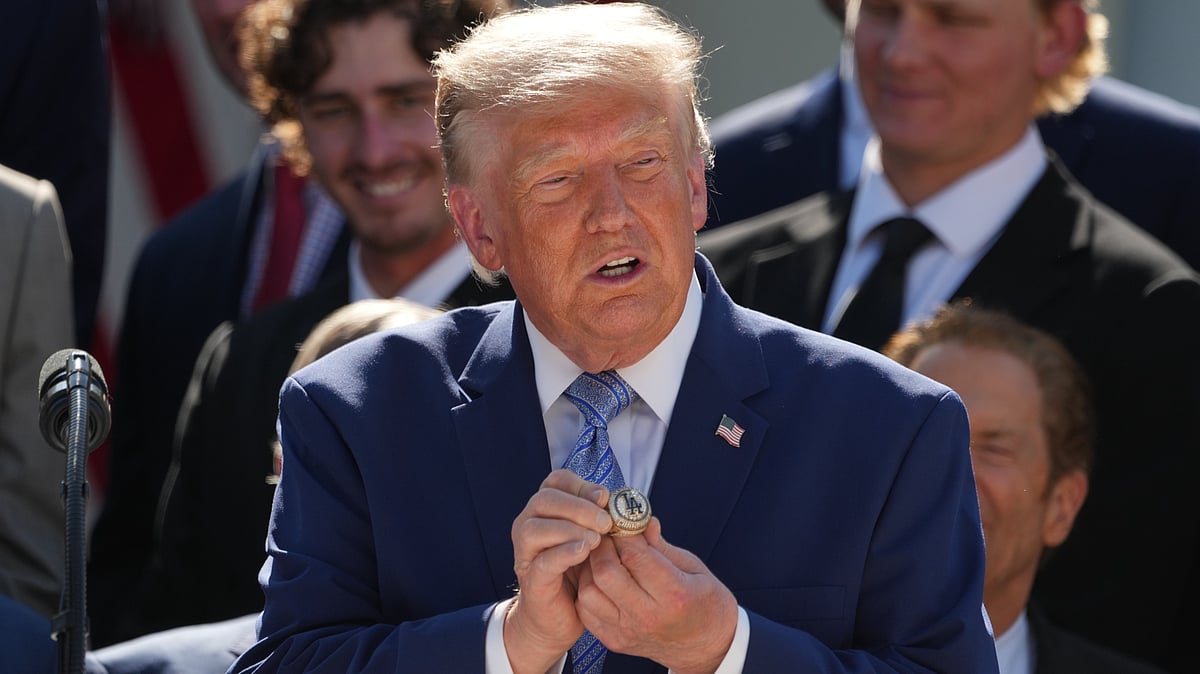 Donald Trump holds a championship ring during the Dodgers' White House visit.