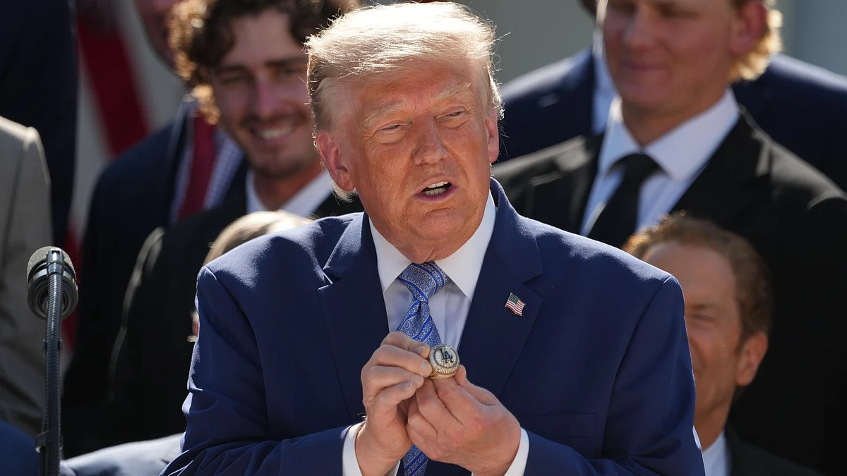 Donald Trump holds a championship ring during the Dodgers' White House visit.
