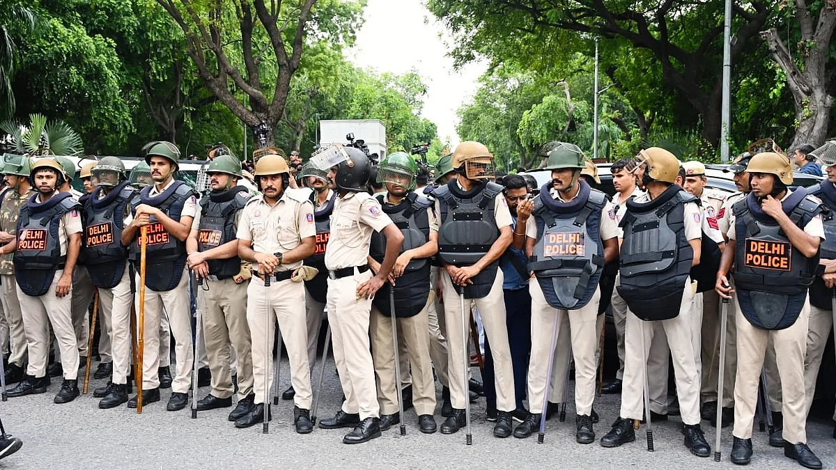 Delhi Police personnel on guard the day after clashes with protesters, 21 July 