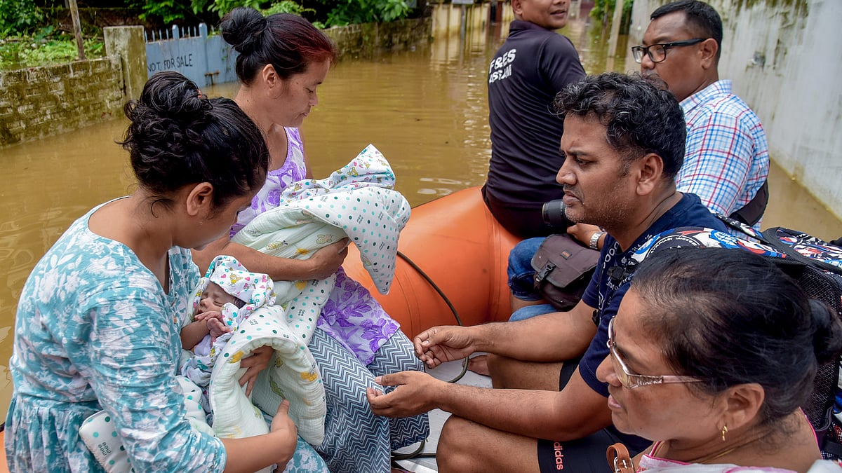 Archer Jayanta Talukdar and family being moved to a safer place at Rukminigaon, Guwahati
