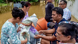 Archer Jayanta Talukdar and family being moved to a safer place at Rukminigaon, Guwahati