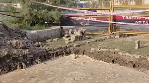Borewell pit dug by Greater Noida Authority filled with rainwater following recent showers.
